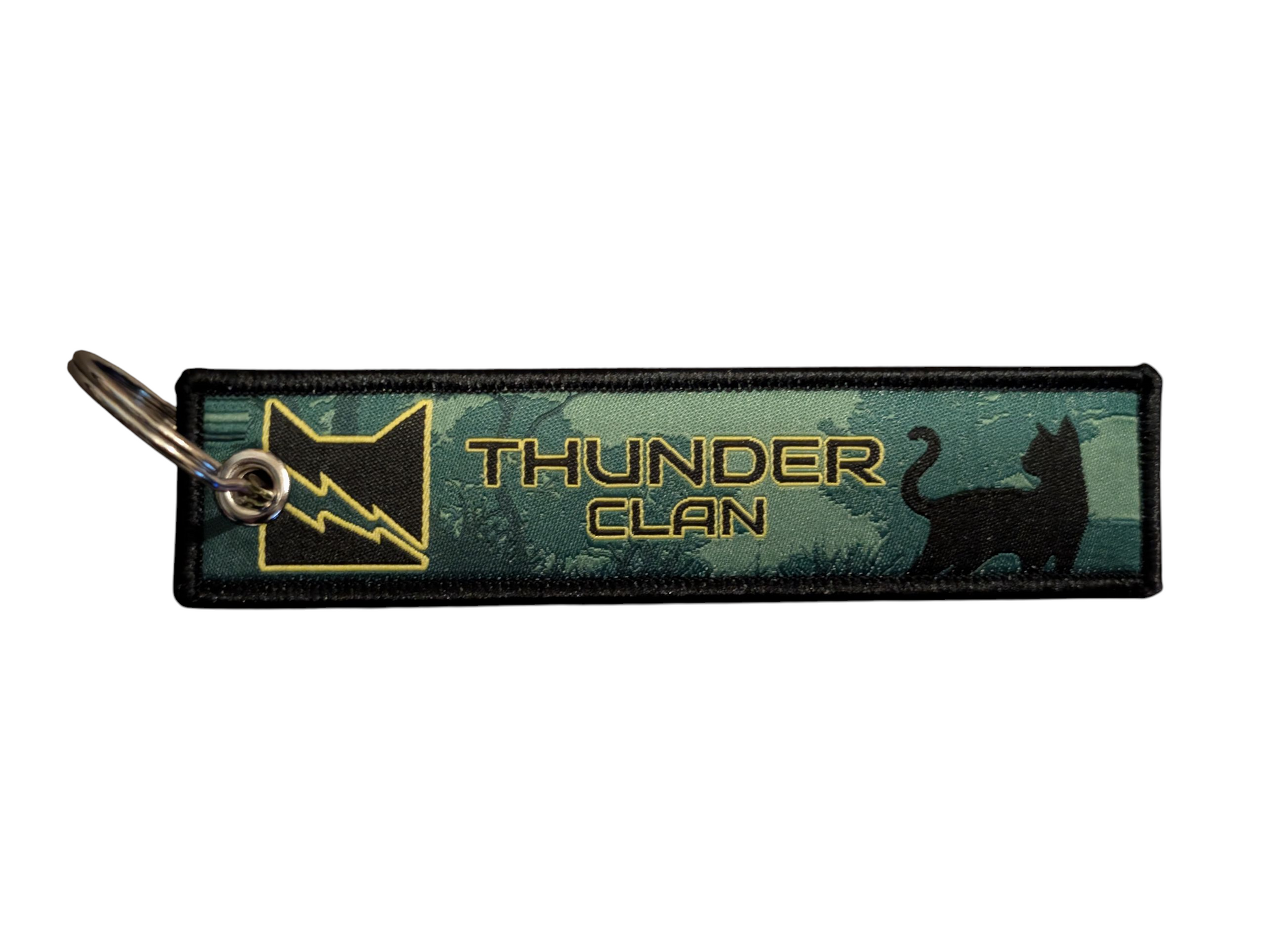 Keychain with 'Thunder Clan' logo and design on a green background